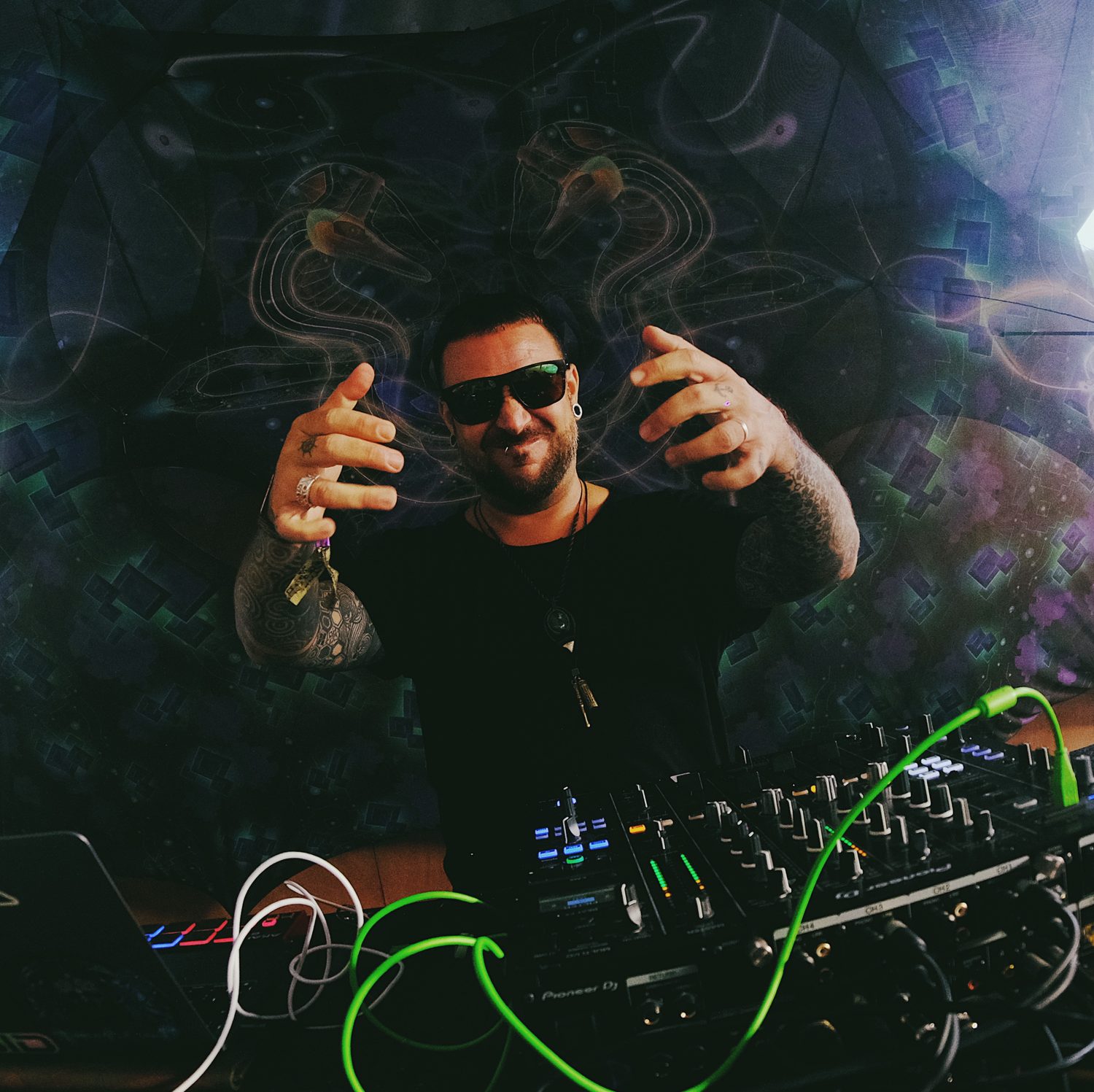 Amplify in sunglasses behind the mixer